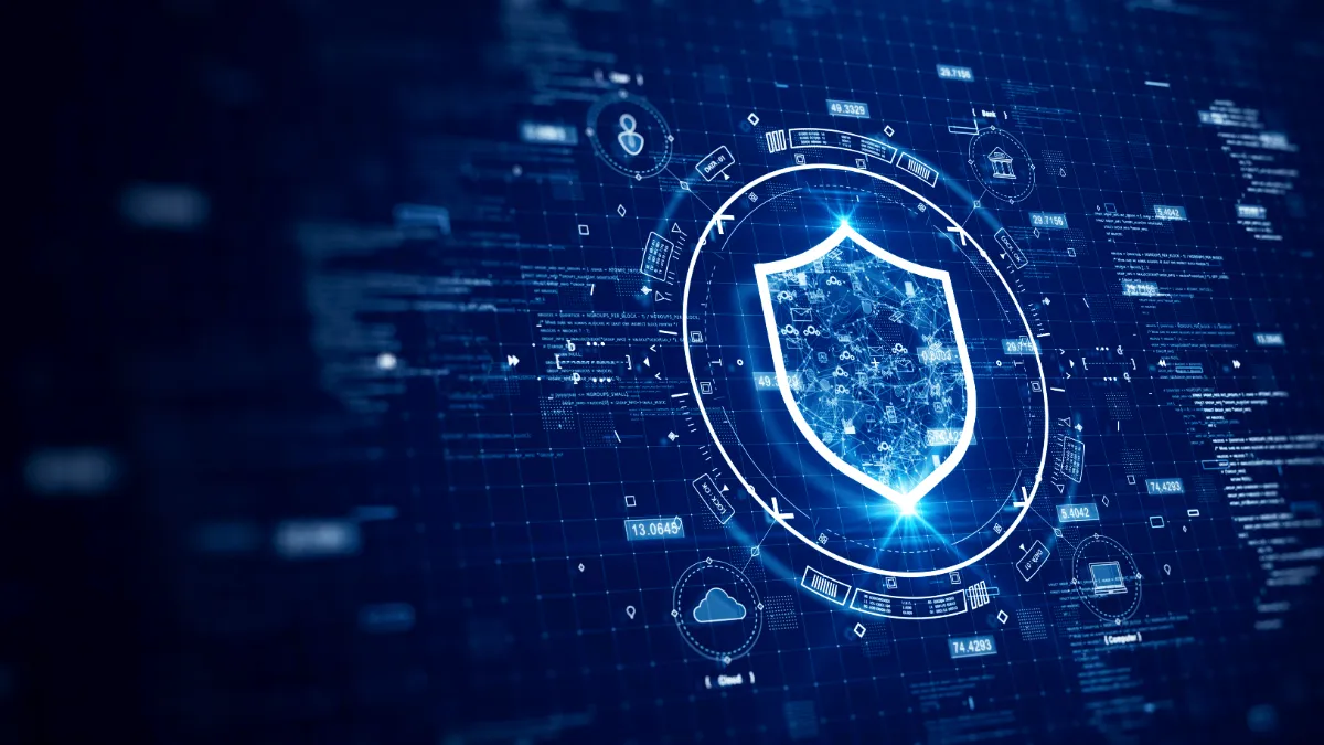 A digital shield icon surrounded by cybersecurity data graphics, representing online threat protection